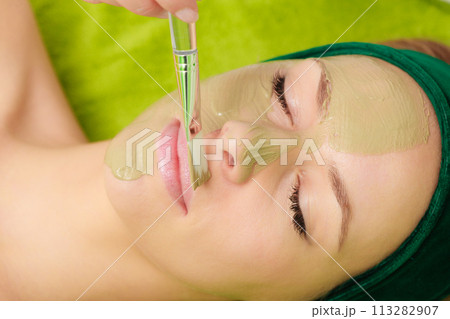 Woman having algae mud mask on face Woman having algae mud mask on face 113282907