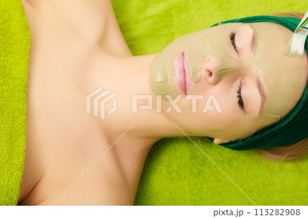 Woman having algae mud mask on face 113282908