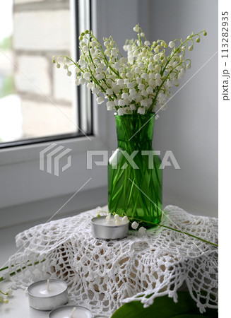 Composition of lily of the valley. Spring concept. A gift to a woman. Composition of lily of the valley. Spring concept. A gift to a woman. 113282935