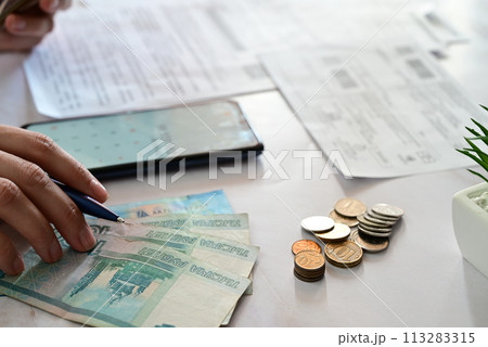 Stressed man shocked with amount to be paid for electricity,financial problem 113283315