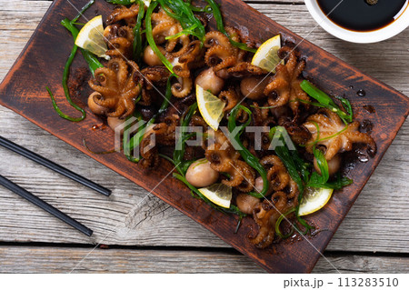 Baby octopus fried with lemon Baby octopus fried with lemon 113283510