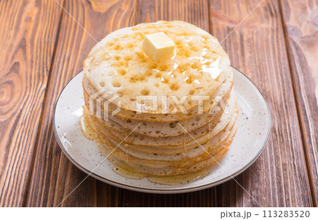 Moroccan traditional eating . Pancakes with honey Moroccan traditional eating . Pancakes with honey 113283520