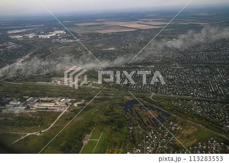 View from the plane when landing on an industrial city View from the plane when landing on an industrial city 113283553