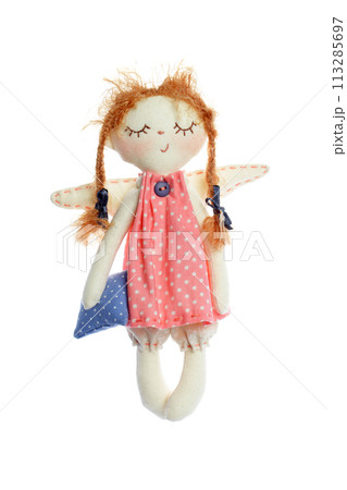 Handmade doll sleeping girl holding pillow isolated on white background, kid toy Handmade doll sleeping girl holding pillow isolated on white background, kid toy 113285697