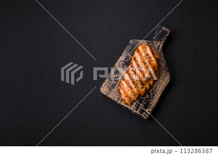 Delicious fresh grilled chicken fillet with spices and herbs 113286387