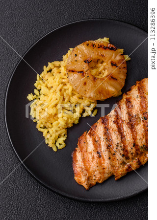 Delicious fresh grilled chicken fillet with spices and herbs Delicious fresh grilled chicken fillet with spices and herbs 113286396