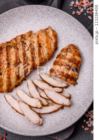 Delicious fresh grilled chicken fillet with spices and herbs 113286408