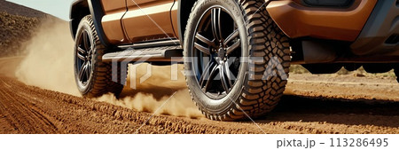 truck is driving on a dirt road with a lot of dust. The tires are black and the truck is leaving a trail of dust behind it. truck is driving on a dirt road with a lot of dust. The tires are black and the truck is leaving a trail of dust behind it. 113286495