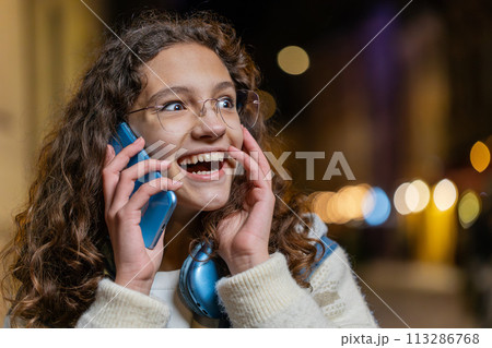 Phone call good news gossip girl in pleasant conversation on smartphone enjoying talking with friend 113286768