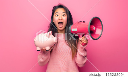 Enthusiastic young Asian woman with megaphone and a piggy bank, symbolizing smart consumerism and enthusiasm for savings. Voice loud budgeting, bright minimalistic background 113288094