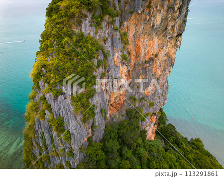 An aerial view of the Phra Nang beach of water surrounded by mountains 113291861