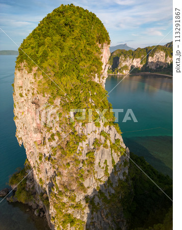 An aerial view of the Phra Nang beach of water surrounded by mountains 113291867