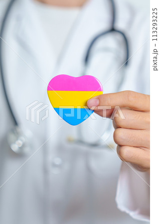 Pansexual Pride Day and LGBT pride month concept. Doctor hand holding pink, yellow and blue heart shape for Lesbian, Gay, Bisexual, Transgender, Queer and Pansexual community Pansexual Pride Day and LGBT pride month concept. Doctor hand holding pink, yellow and blue heart shape for Lesbian, Gay, Bisexual, Transgender, Queer and Pansexual community 113293225