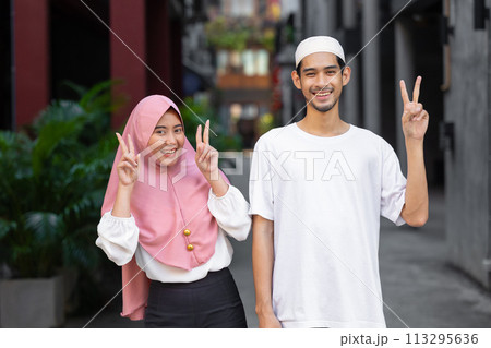 portrait happy muslim teen man and women couple lover friend standing together enjoy fun lifestyle outdoors portrait happy muslim teen man and women couple lover friend standing together enjoy fun lifestyle outdoors 113295636