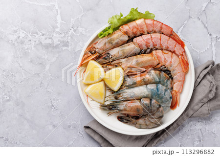 Raw shrimps on plate Raw shrimps on plate 113296882