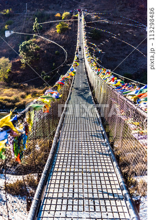 The Punakha Suspension Bridge at the Punakha Dzong in Bhutan. 113298486