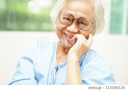 Asian senior woman wearing eyeglasses or vision glasses using a smartphone   113300120