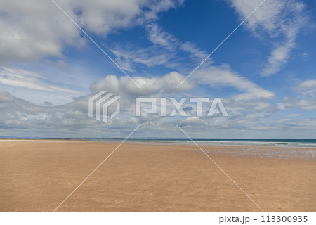 St Andrews Beach in Scotland, where golden sands blend with the clear blue sea St Andrews Beach in Scotland, where golden sands blend with the clear blue sea 113300935