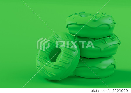 Stack of glazed donut with sprinkles on plain monochrome green color 113301090