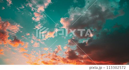 Sunset Sunrise Sky Background. Bright Dramatic Sky In Yellow, Orange And Blue Colors. 113302572