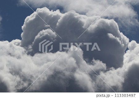 Cloudscape scenery, overcast weather above dark blue sky. Storm clouds floating in a rainy dull day with natural light. White and grey scenic environment background. Nature view. Cloudscape scenery, overcast weather above dark blue sky. Storm clouds floating in a rainy dull day with natural light. White and grey scenic environment background. Nature view. 113303497