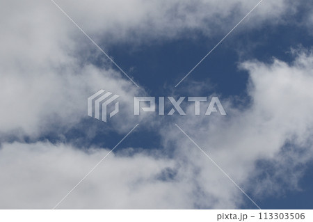 Cloudscape scenery, overcast weather above dark blue sky. Storm clouds floating in a rainy dull day with natural light. White and grey scenic environment background. Nature view. Cloudscape scenery, overcast weather above dark blue sky. Storm clouds floating in a rainy dull day with natural light. White and grey scenic environment background. Nature view. 113303506