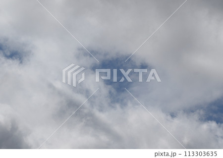 Cloudscape scenery, overcast weather above dark blue sky. Storm clouds floating in a rainy dull day with natural light. White and grey scenic environment background. Nature view. Cloudscape scenery, overcast weather above dark blue sky. Storm clouds floating in a rainy dull day with natural light. White and grey scenic environment background. Nature view. 113303635