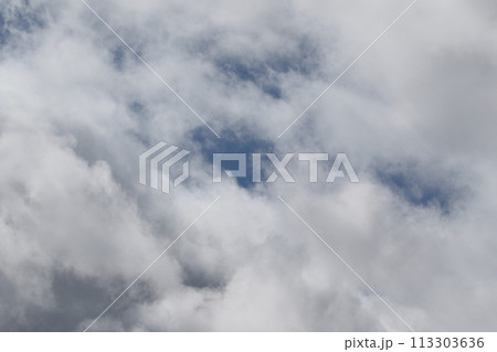 Cloudscape scenery, overcast weather above dark blue sky. Storm clouds floating in a rainy dull day with natural light. White and grey scenic environment background. Nature view. Cloudscape scenery, overcast weather above dark blue sky. Storm clouds floating in a rainy dull day with natural light. White and grey scenic environment background. Nature view. 113303636