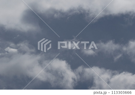 Cloudscape scenery, overcast weather above dark blue sky. Storm clouds floating in a rainy dull day with natural light. White and grey scenic environment background. Nature view. Cloudscape scenery, overcast weather above dark blue sky. Storm clouds floating in a rainy dull day with natural light. White and grey scenic environment background. Nature view. 113303666