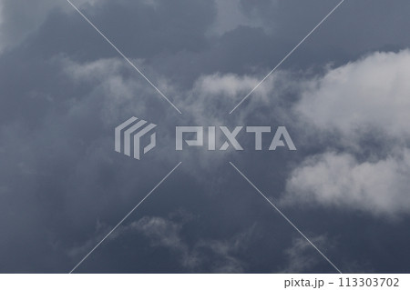 Cloudscape scenery, overcast weather above dark blue sky. Storm clouds floating in a rainy dull day with natural light. White and grey scenic environment background. Nature view. Cloudscape scenery, overcast weather above dark blue sky. Storm clouds floating in a rainy dull day with natural light. White and grey scenic environment background. Nature view. 113303702