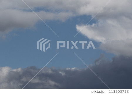 Cloudscape scenery, overcast weather above dark blue sky. Storm clouds floating in a rainy dull day with natural light. White and grey scenic environment background. Nature view. Cloudscape scenery, overcast weather above dark blue sky. Storm clouds floating in a rainy dull day with natural light. White and grey scenic environment background. Nature view. 113303738