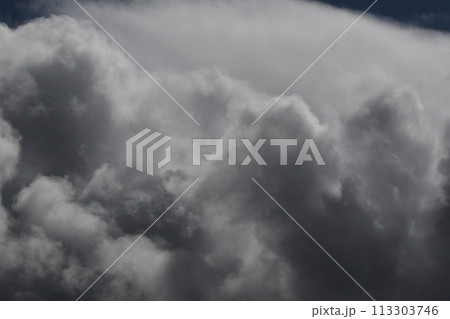 Cloudscape scenery, overcast weather above dark blue sky. Storm clouds floating in a rainy dull day with natural light. White and grey scenic environment background. Nature view. Cloudscape scenery, overcast weather above dark blue sky. Storm clouds floating in a rainy dull day with natural light. White and grey scenic environment background. Nature view. 113303746