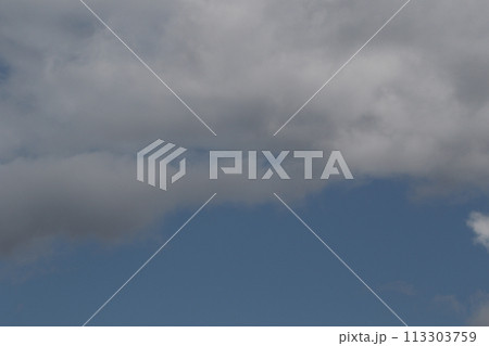 Cloudscape scenery, overcast weather above dark blue sky. Storm clouds floating in a rainy dull day with natural light. White and grey scenic environment background. Nature view. 113303759