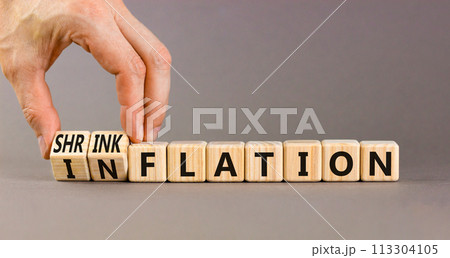 Inflation or shrinkflation symbol. Concept words Inflation Shrinkflation on beautiful wooden blocks. Beautiful grey background. Businessman hand. Business inflation shrinkflation concept. Copy space 113304105