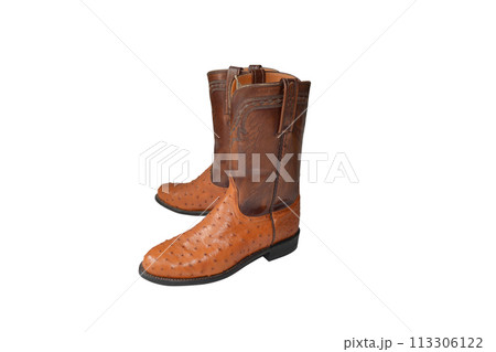 Brown cowboy boots on a white background. 113306122
