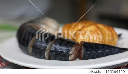 Baked golden potatoes with herring mackerel Baked golden potatoes with herring mackerel 113306560