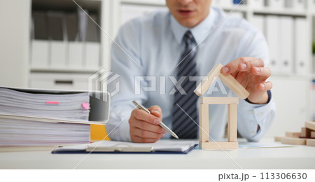 Male hand holds the roof to the lock in Male hand holds the roof to the lock in 113306630