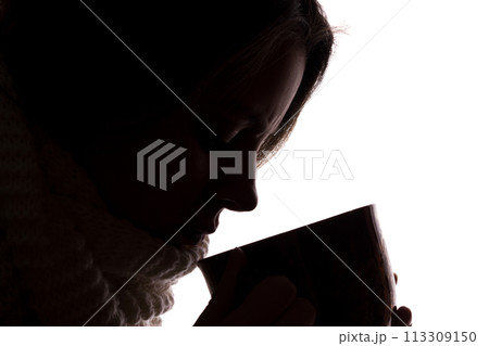 Silhouette of a young woman with a cup Silhouette of a young woman with a cup 113309150