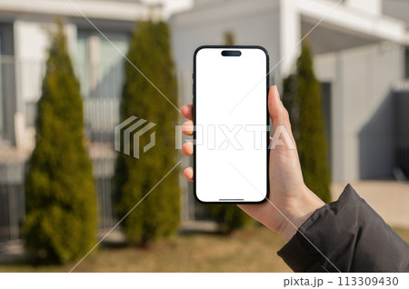 Berlin Germany January 21 2024 Hand holding mobile phone screen, blank iphone smartphone display 113309430