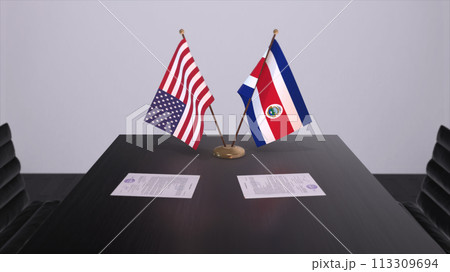 Costa Rica and USA at negotiating table. Business and politics 3D illustration. National flags, diplomacy deal. International agreement Costa Rica and USA at negotiating table. Business and politics 3D illustration. National flags, diplomacy deal. International agreement 113309694