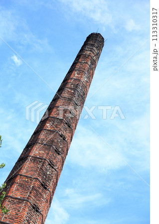 Smokestack of an old abandoned industrial Smokestack of an old abandoned industrial 113310317