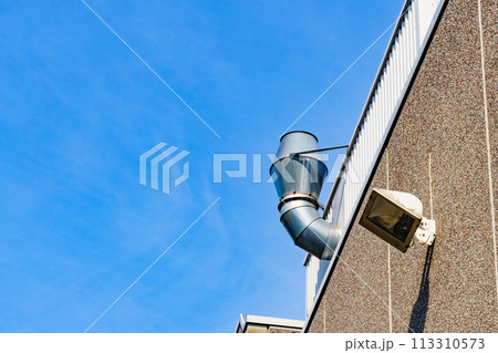 Ventilation chimney on the wall. 113310573