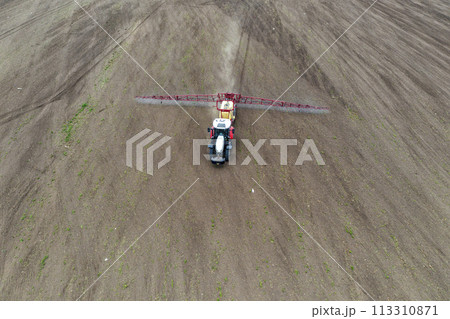 tractor spraying grain tractor spraying grain 113310871