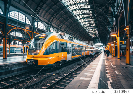 Train traveling through a train station next to a platform. Generative AI Train traveling through a train station next to a platform. Generative AI 113310968