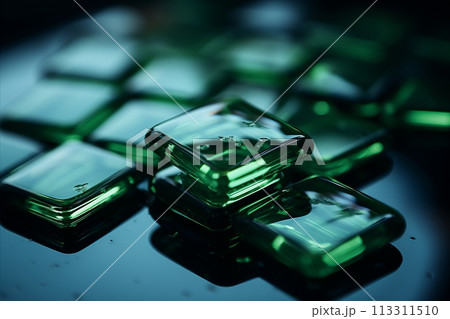arrangement of beautiful emerald green glass shards on an elegant glass tray 113311510