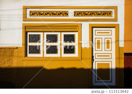 Beautiful facade of the houses at the historical downtown of the heritage town of Salamina located at the Caldas department in Colombia. 113313642