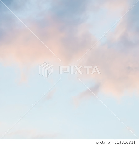 Background of blue sky with pale pink clouds at sunset Background of blue sky with pale pink clouds at sunset 113316811