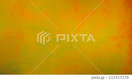 An image of a shiny metal wall painted in a golden yellow and green. Image for use in Background or copy space. 113317270