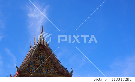 Blue sky and white clouds with sun beam over the buddhist temple roof in Thailand. Picture for use in Background image or copy space Blue sky and white clouds with sun beam over the buddhist temple roof in Thailand. Picture for use in Background image or copy space 113317290