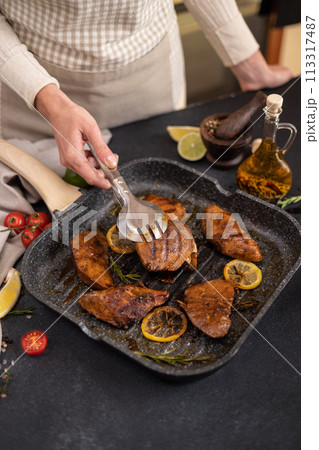 grilled pieces of Organic Tuna Steak on a grill frying pan 113317487